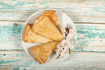 homemade thin pancakes are on the plate