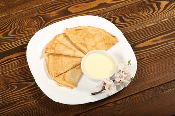 homemade thin pancakes are on the plate