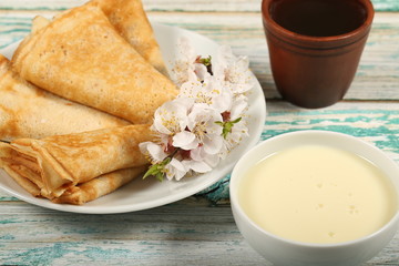 homemade thin pancakes are on the plate