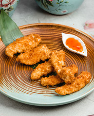 chicken nuggets with sauce on table