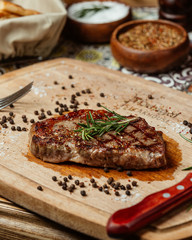 juicy steak with rosemary and black pepper