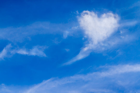 Perfect of real heart shaped from white softy cloud shown on cloudy blue sky. Background for love picture, Valentine day or business target or meteorology or inspiration concept