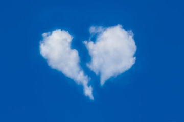 Perfect of broken heart shaped from white softy and fluffy cloud shown on fresh blue sky. Background for love picture and Valentine’s day or business target or meteorology or inspiration concept
