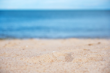 Fototapeta na wymiar Landscape image of sand on tropical beach with blue sea and sky background