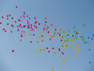 many colored balls fly to the sky