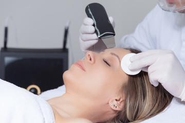 woman face skin treatment in beauty health clinic close