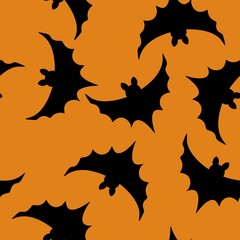Black bats on orange background seamless Halloveen vector pattern.