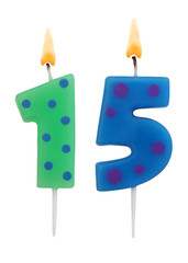 Burning birthday candles isolated on white background, number 15