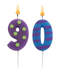 Burning colorful birthday candles on white background, number 90