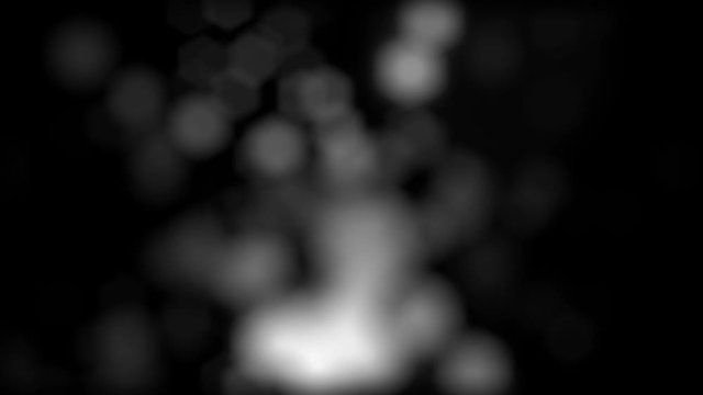 Abstract silver glitter texture, blurred round particles falling down, monochrome. Animation. Moving white spheres on black background, seamless loop.
