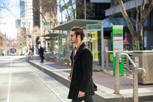 Businessman Crossing City Street