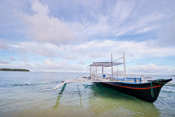 Fototapeta na wymiar Beach with traditional fishing boat.