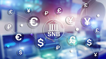 Different currencies on a virtual screen. SNB. Swiss National Bank.