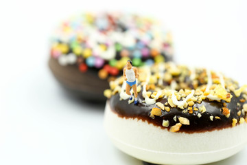 Miniature people : marathon runners with measuring tape of Sweet dessert ,jogging and running,Active and healthy lifestyle concept.