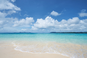 Beautiful seascape. Sandy beach with blue clear water.