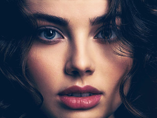 Closeup face of a beautiful woman with a smoky eye makeup