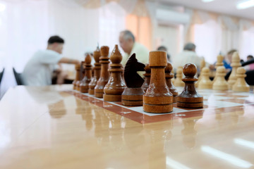 Chess pieces on a game Board. Play as a hobby or business concept. People play chess.