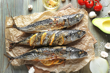Baked mackerel fish on wooden table