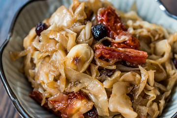 Cabbage Salad with Caramelized Onions, Dried Tomatoes and Currants.