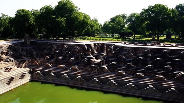 The sacred reservoir has steps to reach the bottom and numerous small shrines.