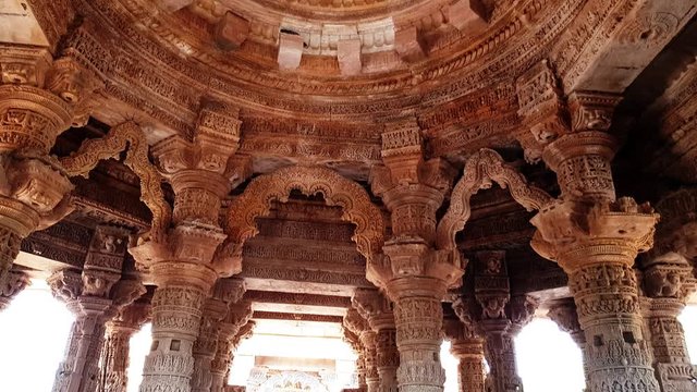 Sabhamandapa is parallelogram in plan with rows of pillars opening entrance on each side diagonally. Extensively carved exterior has a series of recessed corners giving an impression of the star-like