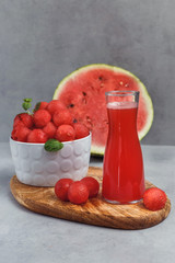 Fruit salad with watermelon balls and mint.  Fresh watermelon vegetarian vitamin juice.