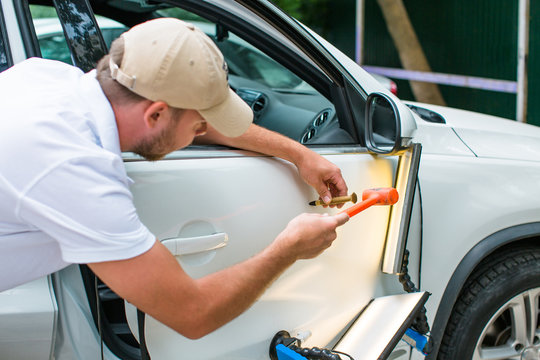 Repairing car dent after the accident by paintless dent repair  I