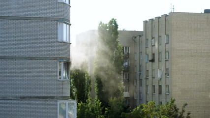 Clouds of grey smoke coming from the window of a burning apartment. 4K