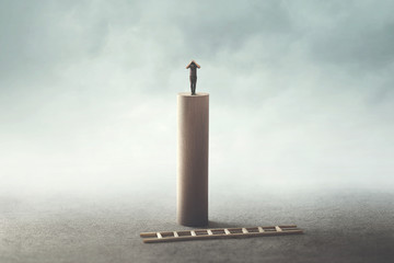 desperate business man on the top of the tower