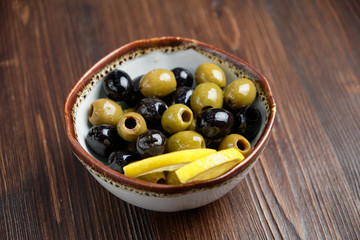 Olives and olives with lemon. menu for catering