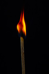 burning matches on a black background