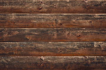 Cracked wood background. Brown old wooden planks. Horizontal lines on fence. Vintage rustic pattern. Timber plank, scratched surface. Dirty wall, grunge texture. Shabby table. Vintage style.