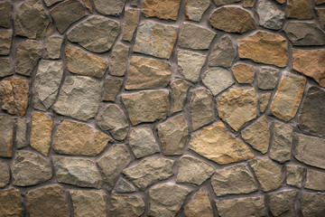 Brown stone texture, retro style. Brick wall background. Abstract rocks pattern. Gray stones, textured surface. Natural backdrop. Marble facade building details. Mosaic of bricks. Grey grunge surface.