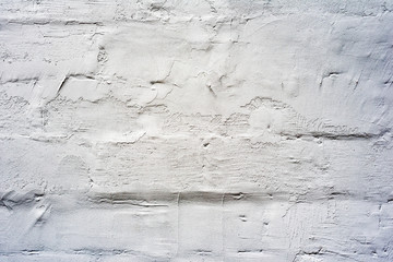 Texture of a brick wall with cracks and scratches which can be used as a background