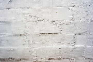 Obraz premium Texture of a brick wall with cracks and scratches which can be used as a background