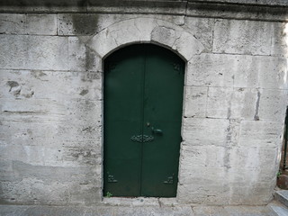 Ancient door in an ancient wall in the old part of Sambul