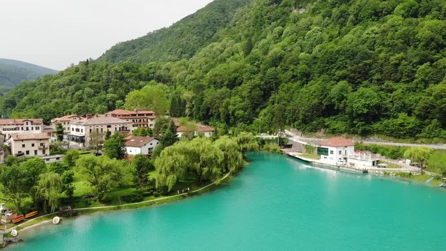 Aerial of Most na Soci Lake in Soca Valley Slovenia. Wonderful Turquise Alpine Water Reservoir and Resort Under Julian Alps