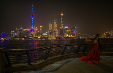 Fototapeta premium A Beautiful night around the Bund area in Shanghai city , this viewpoint offers the best spot for watching the spectacular skyline of this massive city with the most famous shanghai tower.