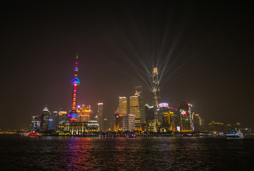 Obraz premium A Beautiful night around the Bund area in Shanghai city , this viewpoint offers the best spot for watching the spectacular skyline of this massive city with the most famous shanghai tower.