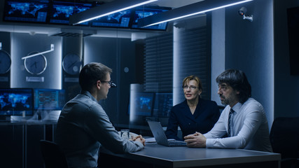 On a Job Interview Two Senior Managers Ask Young Candidate Questions. Secret Service Recruiting Talented Young Man. Serious People Working in Government Agency.