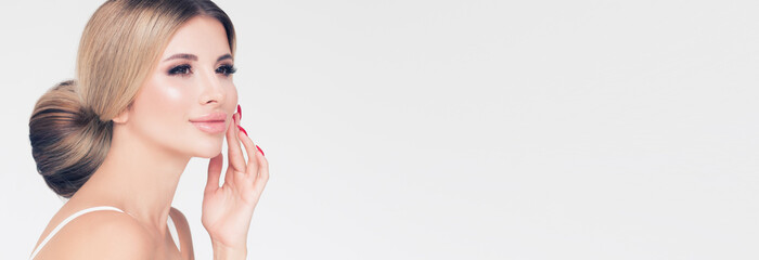 Beautiful woman face. Healthy hair and clear skin. Skincare and facial treatment concept