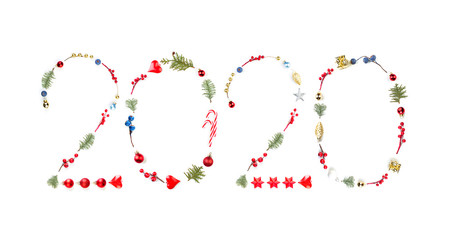 Happy New Year 2020. Creative Number 2020 composition with Christmas tree branch, red holly berries, baubles and Xmas decor isolated on white background. Beautiful design element for Christmas card
