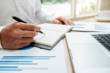 Business team brainstorming and discussing with financial data and report graph. Teamwork meeting working concept.
