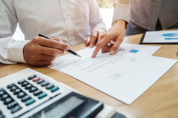 Business team brainstorming and discussing with financial data and report graph. Teamwork meeting working concept.
