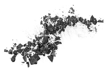 Particles of charcoal on a white background, top view.