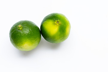 Fresh limes isolated on white