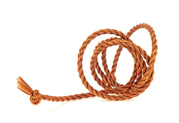 Brown rope isolated on a white background, selective focus.