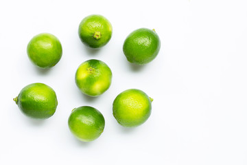 Fresh limes isolated on white background.