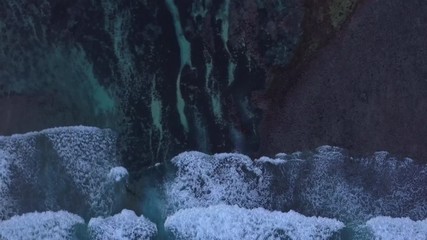 Aerial: Above the ocean, aerial view at the waves and surface, fly cam move  above waves