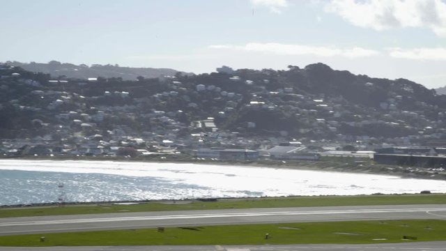 A Cesna 172N airplane from the Wellington Aero Club taking off from Wellington airport in NZ.
